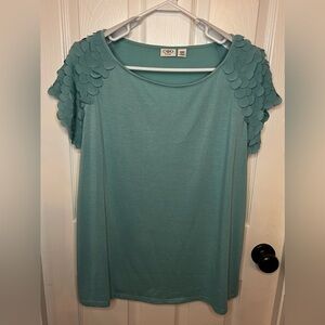 Cato Woman size 18/20W. 65% polyester, 35% rayon. Mint green, short sleeve